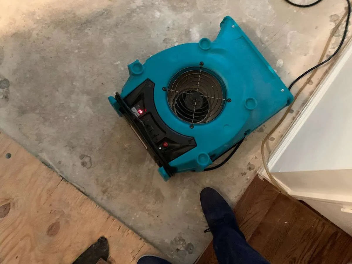 Air mover drying subfloor during Commercial Water Damage Restoration in Picture Rocks